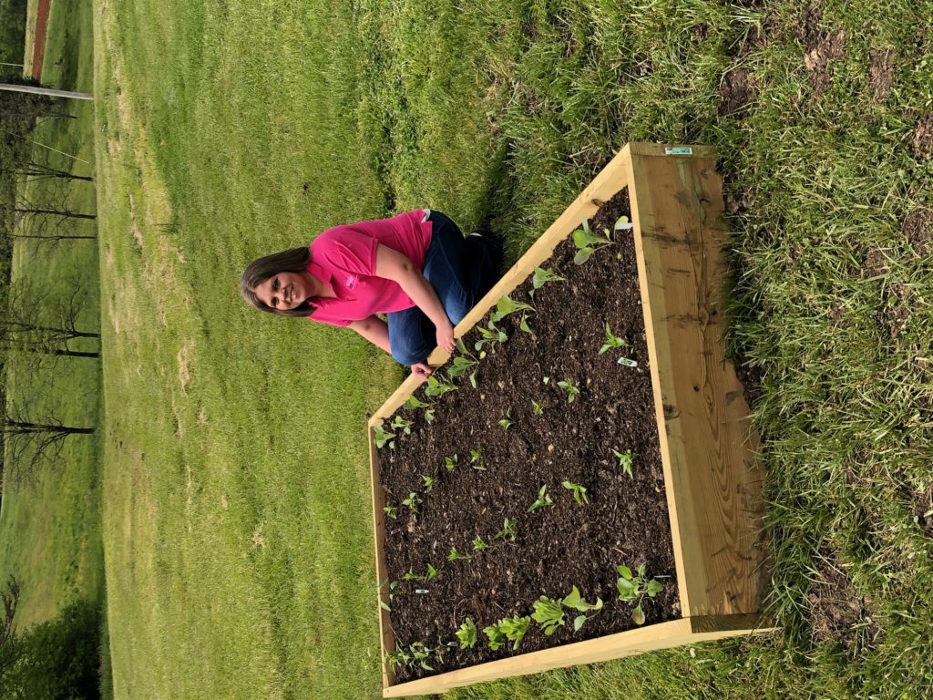 Amanda Royall with her raised bed garden