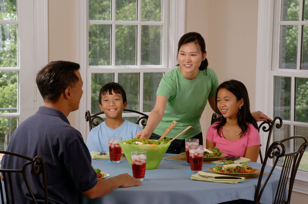 Family eating a meal at the kitchen table